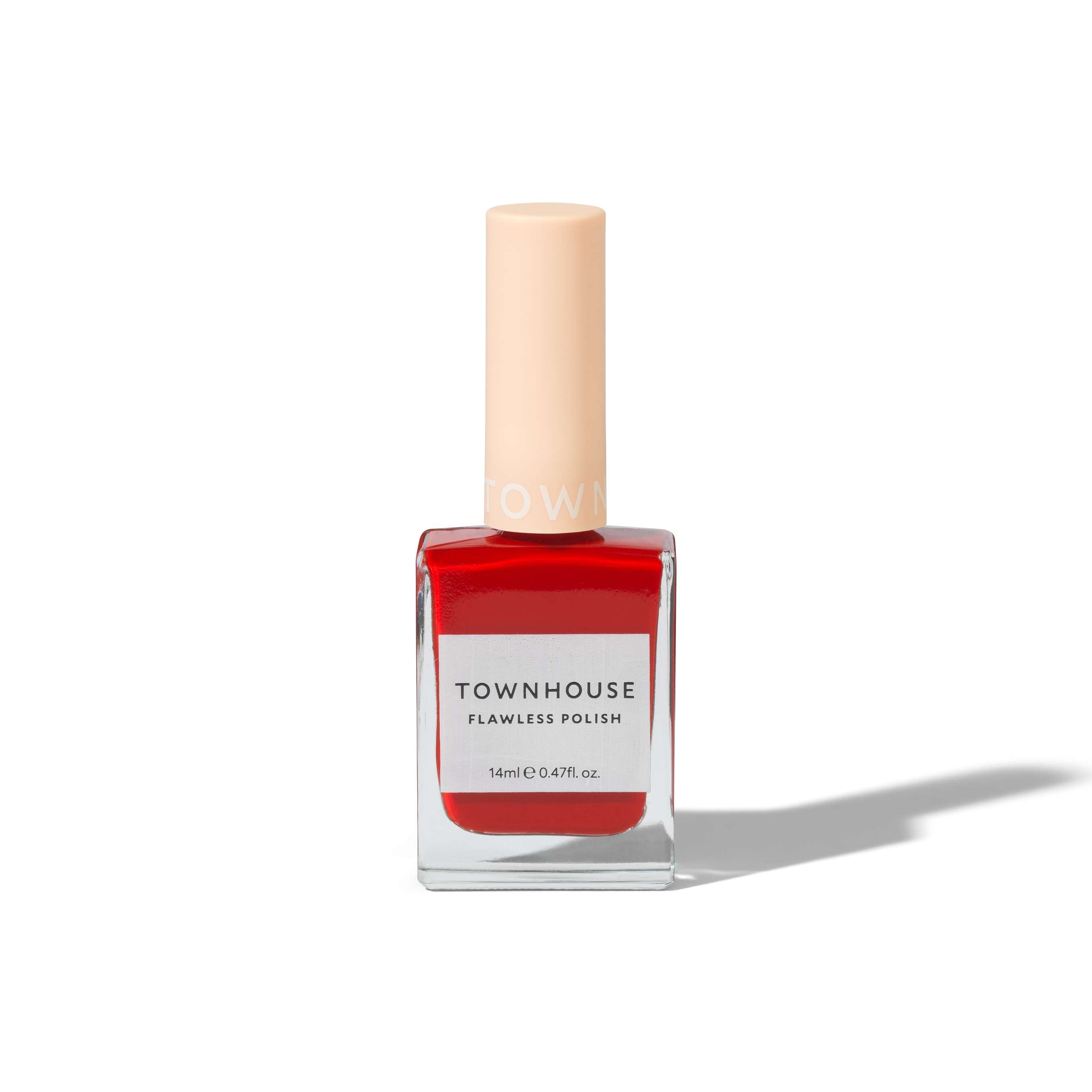 A bottle of TH - Strawberry Polish 14ml in a bright red shade, featuring a square glass bottle and a pale peach cap, casting a shadow on a white background.
