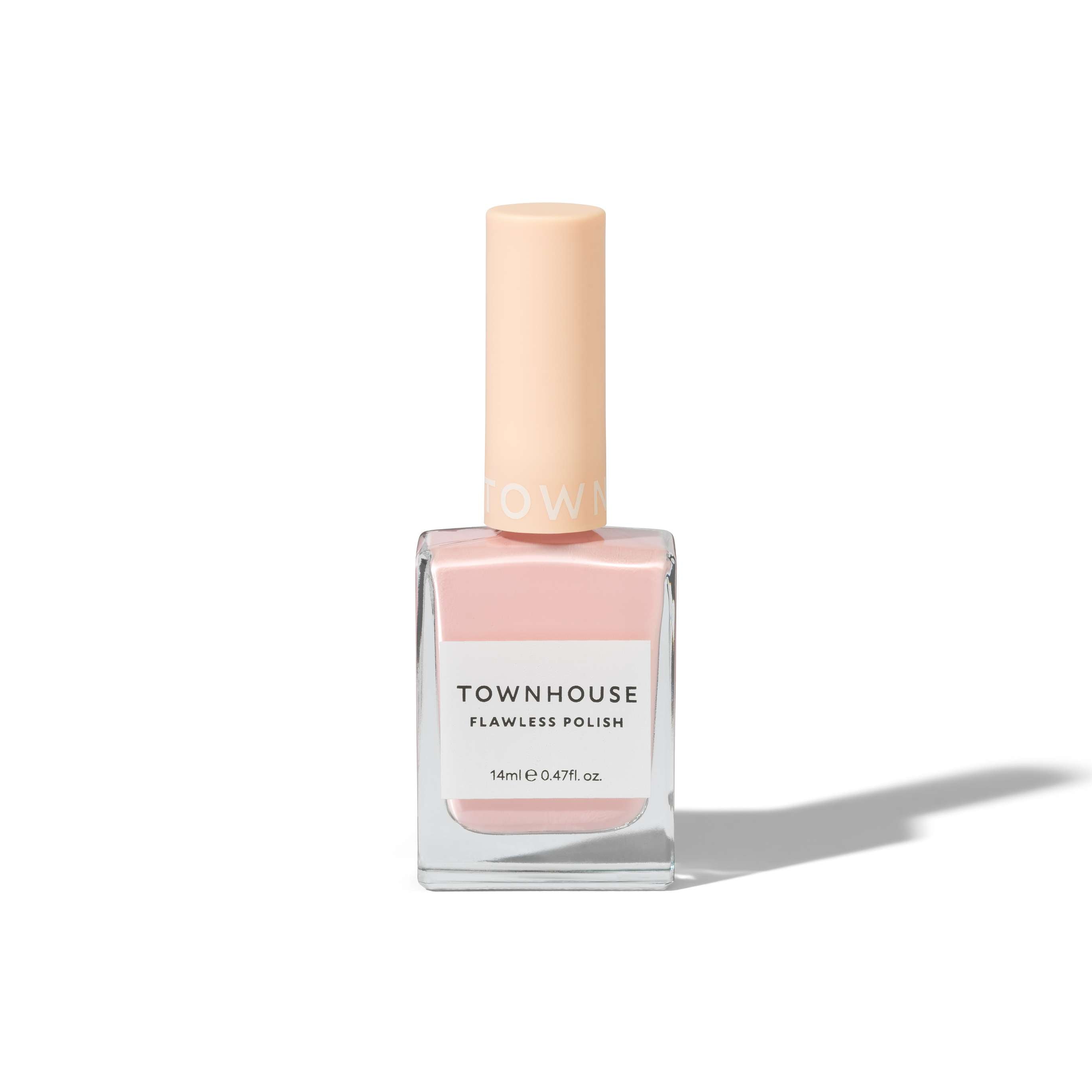 A bottle of TH - Strawberry Milk Polish 14ml, featuring a sheer blush pink nail polish shade, with a square glass base and a light beige cap, is placed on a white background casting a soft shadow.