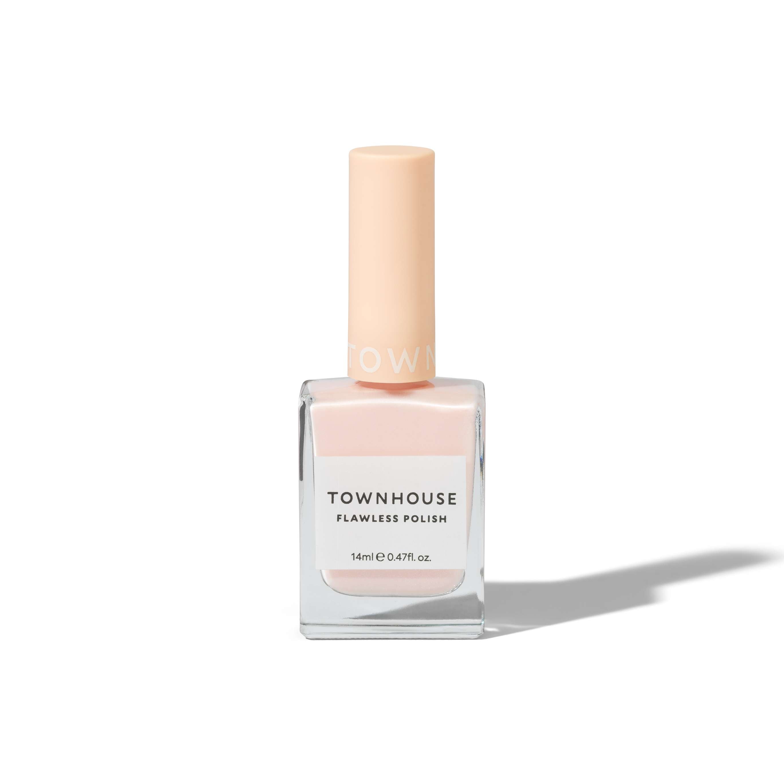 A 14ml bottle of TH - Glazed Marshmallow Polish, featuring a light peach cap and pale baby pink nail polish, stands upright on a white background with a subtle shadow to the right. This glossy polish provides a flawless, elegant finish perfect for any occasion.