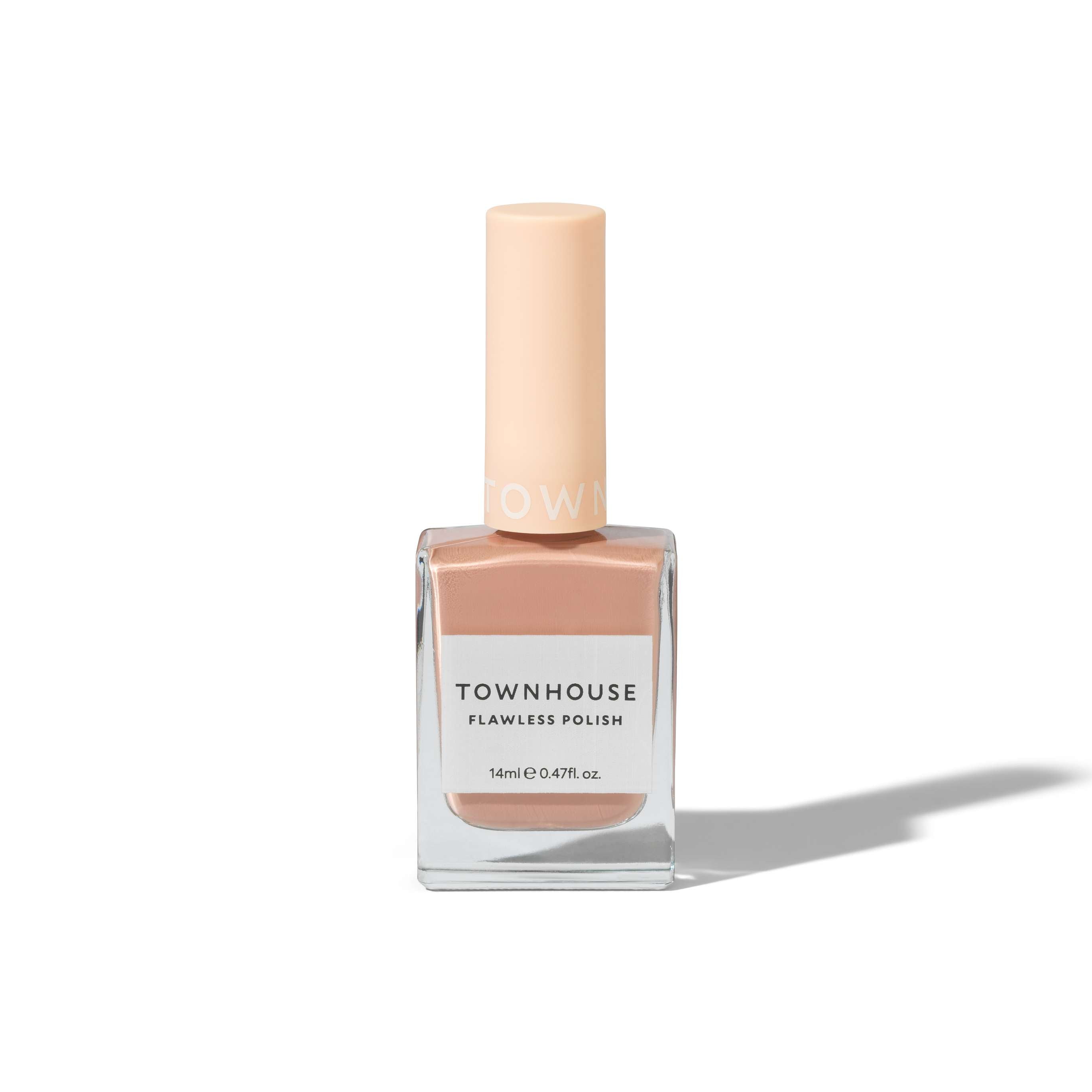 A bottle of TH - Caramel Frappe Polish 14ml, a creamy brown nail polish featuring a light peach-colored cap and matching lacquer, is displayed against a white background with a soft shadow to the right.