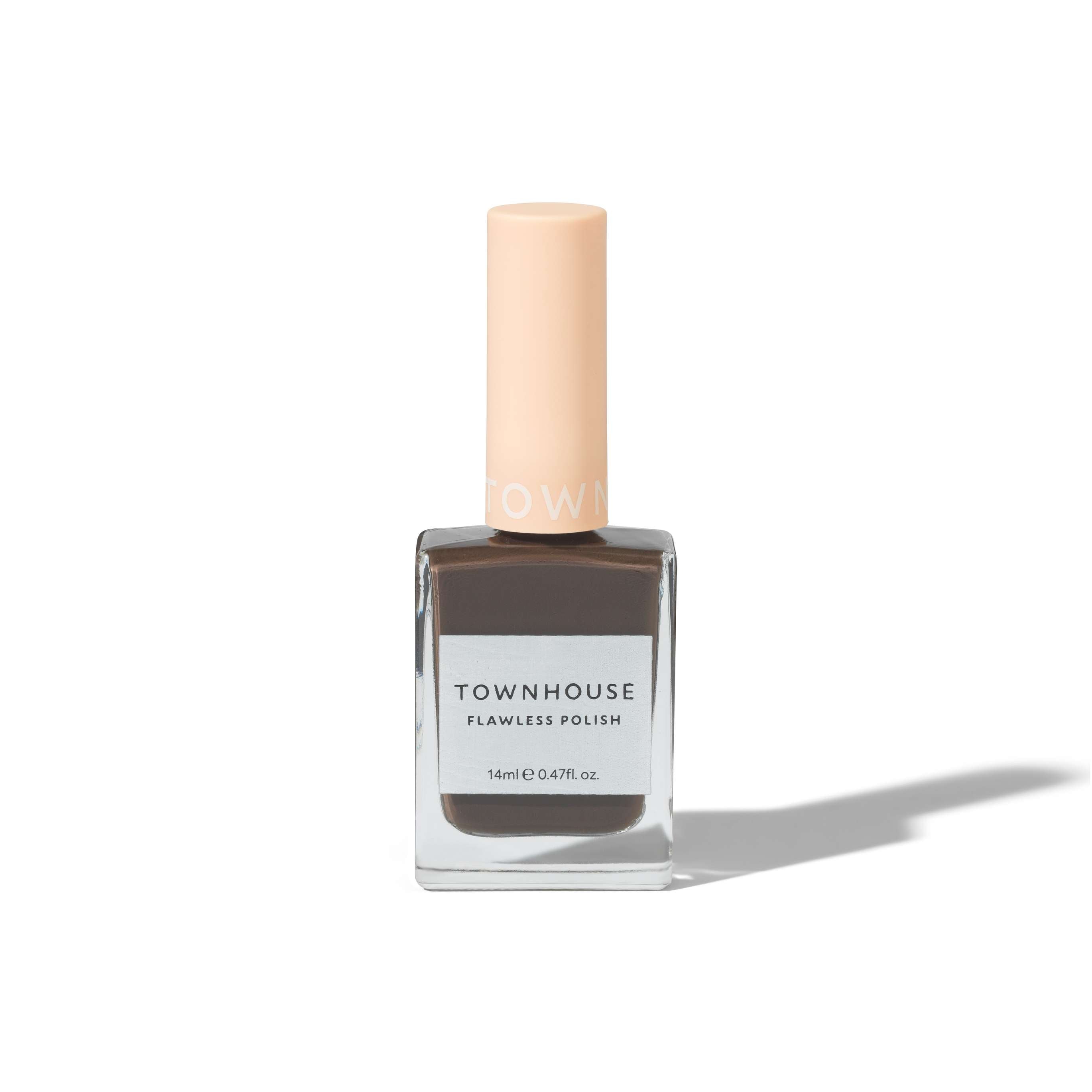 A bottle of TH - Macchiato Polish 14ml nail polish, featuring a light peach cap and grayish-brown polish reminiscent of a deep brown shade, stands upright on a white background with a soft shadow.