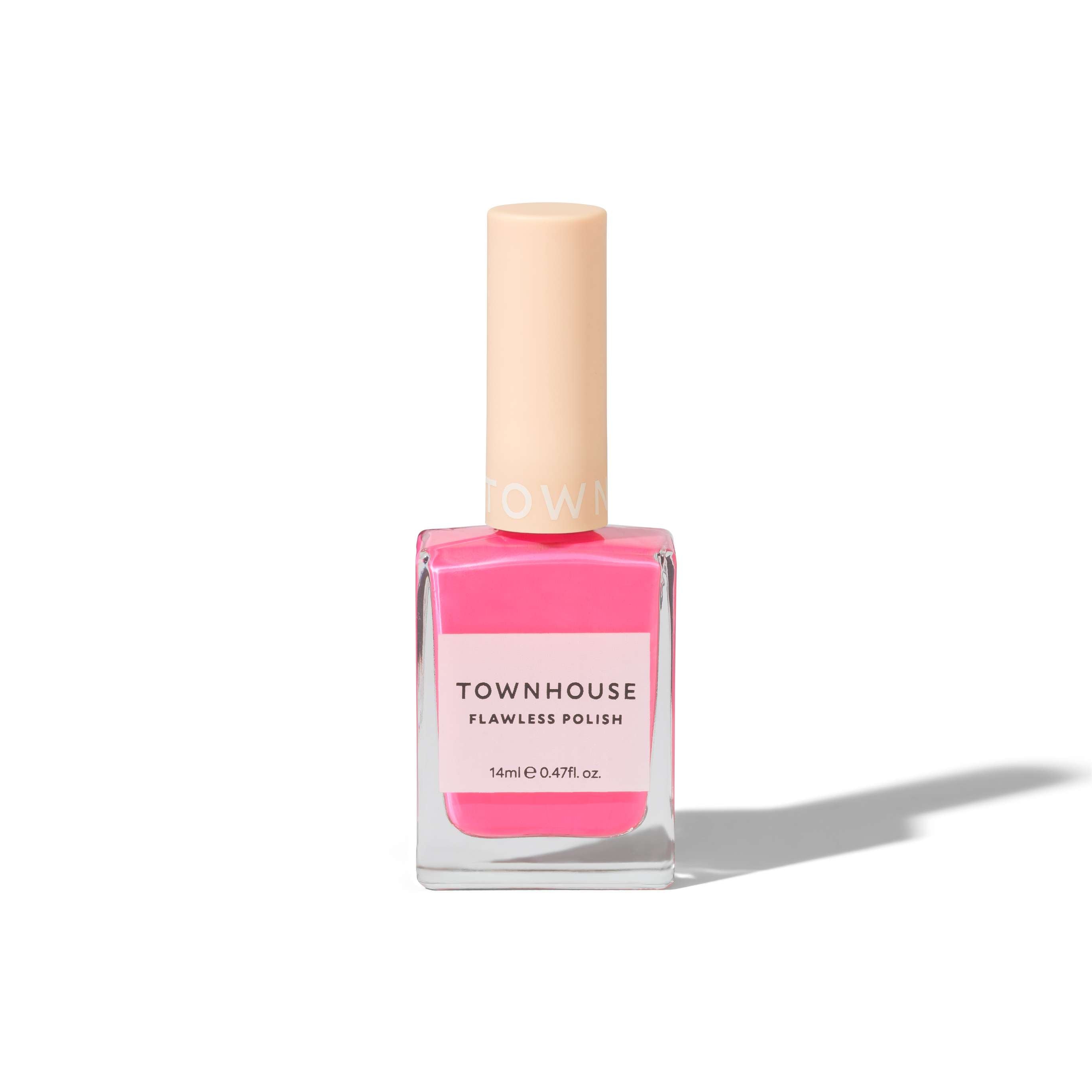 A bottle of TH - Turkish Delight Polish 14ml in bright coral pink, featuring a square glass base and a beige cap, casting a shadow on a white background. Pair it with nourishing cuticle oil for the perfect manicure.