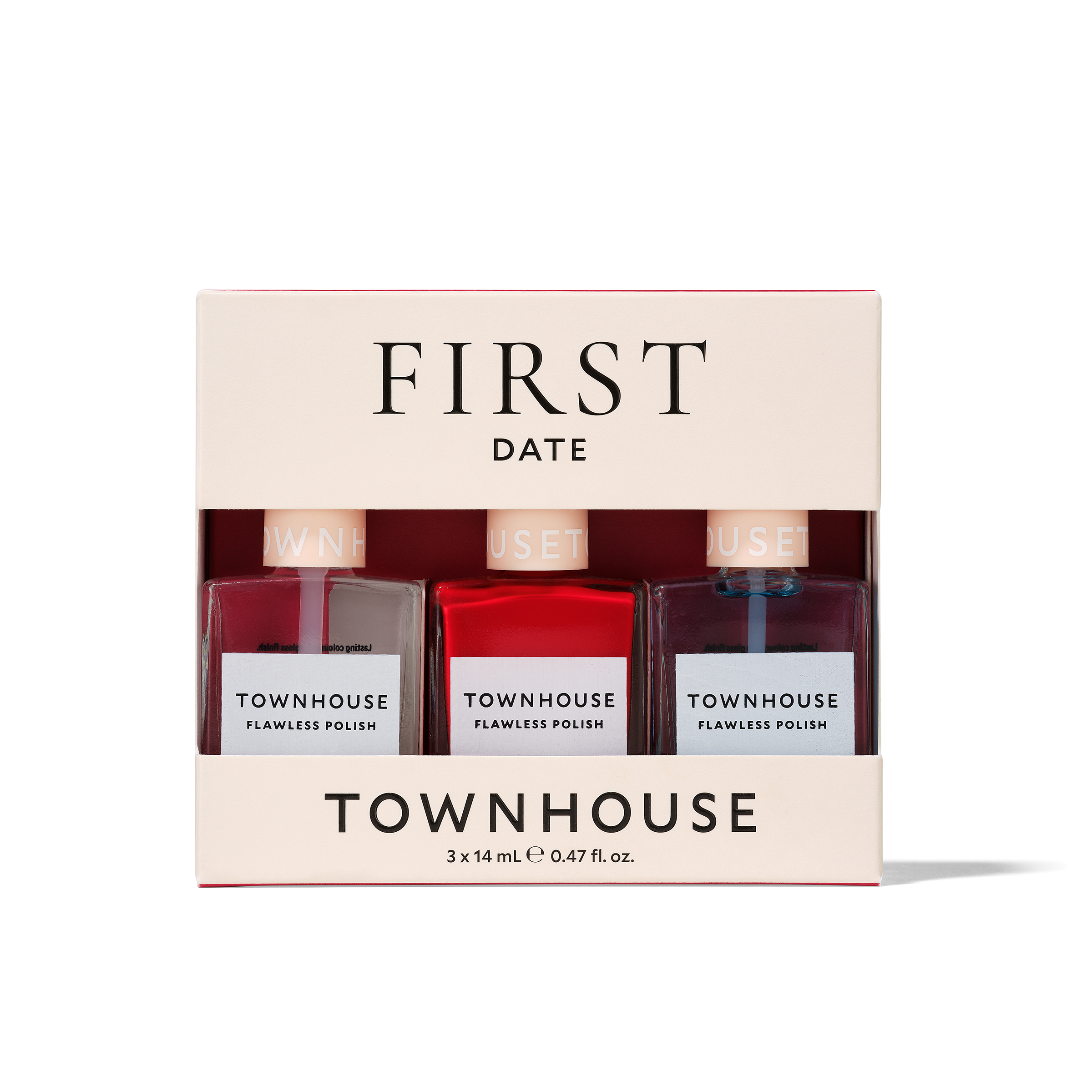 A boxed nail polish gift set called the First Date Kit, featuring three Townhouse polishes in soft pink, bright red, and deep mauve shades—ideal for a classic manicure. The front of the box displays the brand and polish names.